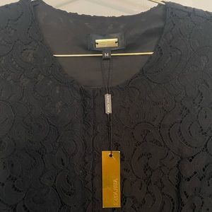 Beautiful black lace romper with tags.